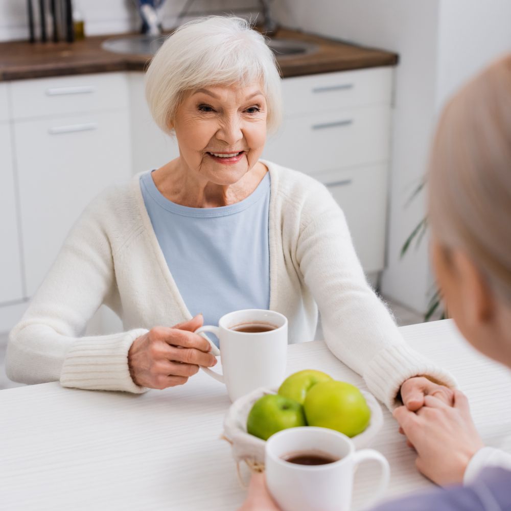 two elderly women having coffee - Maple Care Homes residential assisted living