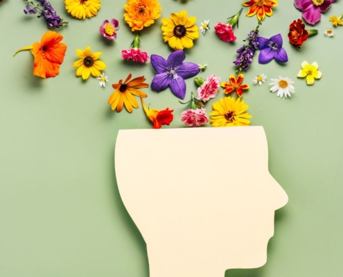 animated visual of human head with pretty flowers exploding from it - Maple Care Homes mental health care