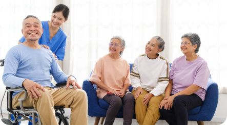 Group of elderly people with female caregiver